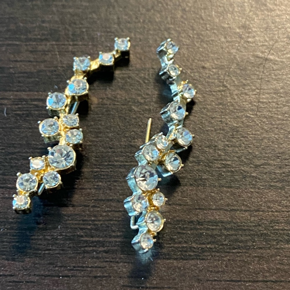 Gold tone climber earrings
